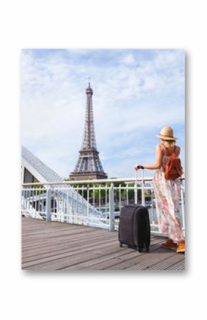 travel to Paris, Europe tour, woman with suitcase near Eiffel Tower, France.