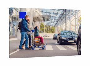 Smiling family with child at airport