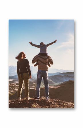 Happy idyllic family against mountains is having fun