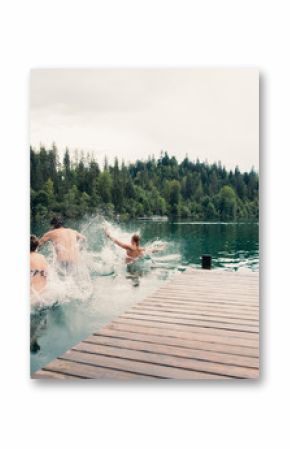 Group of friends having fun at the lake in the morning