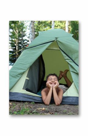 happy boy in camping tent