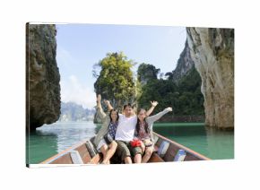 Happy Asian family enjoy a cruise on a holiday adventure by boat trip and beautiful nature landscape lake and mountain, Vacation travel Asia at Khao Sok National Park, Surat Thani, Guilin of Thailand