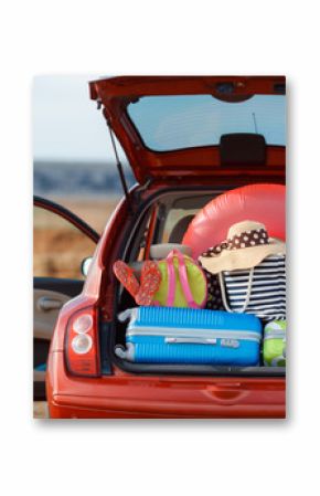 Suitcases and bags in trunk of car ready to depart for holidays