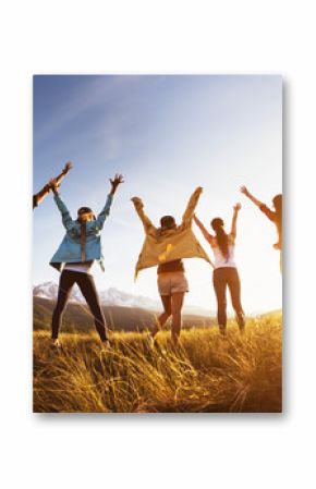 Group happy friends mountains sunset raised arms