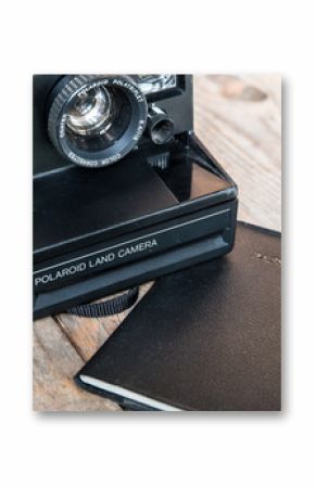 Travel concept-vintage old Polaroid Camera with passport