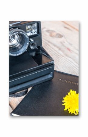 Travel concept-vintage old Polaroid Camera with passport