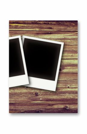 Photo frames on vintage wooden board background texture