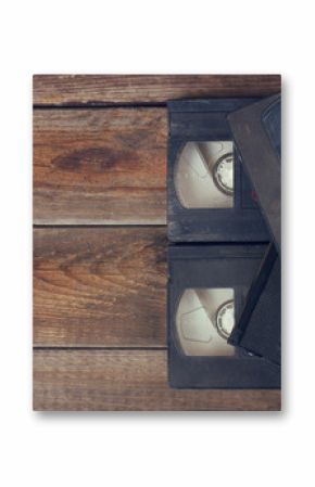 stack of VHS video tape cassette over wooden background. top view photo  