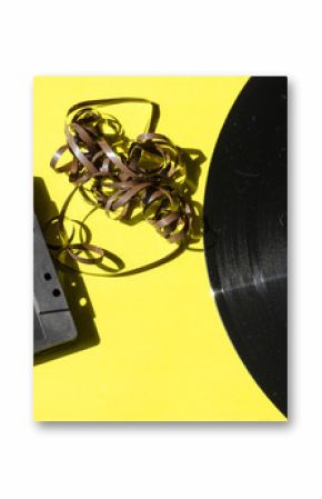 cassette and vinyl record on a colored background yellow retro