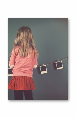 Retro Child Hanging Vintage Photo Film on Wall
