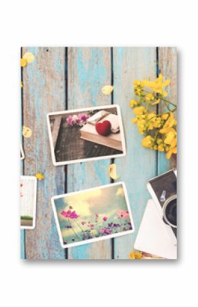 Retro camera and instant paper photo album of valentine day on wood table - photo of remembrance and nostalgia in spring. vintage style