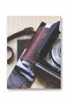 Old retro camera on aged photo album - abstract background