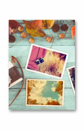 Photo album in remembrance and nostalgia in autumn (fall season) on wood table. instant photo of retro camera - vintage and retro style