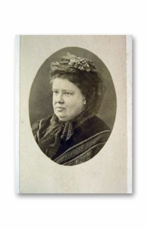 Vintage portrait of woman early 20 century on background.