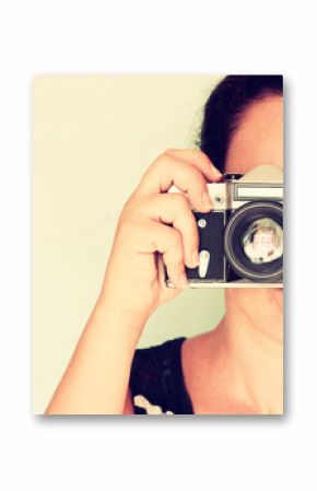young woman holding old camera. vintage effect