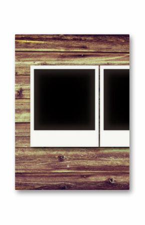 Photo frames on vintage wooden board background texture