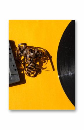 cassette and vinyl record on a colored background orange retro