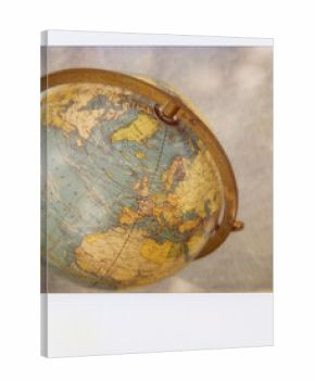 A Polaroid Photograph Of A Vintage Globe