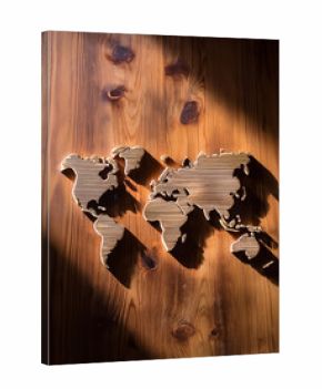 World map in the form of artistic carving or shadow on a wooden surface