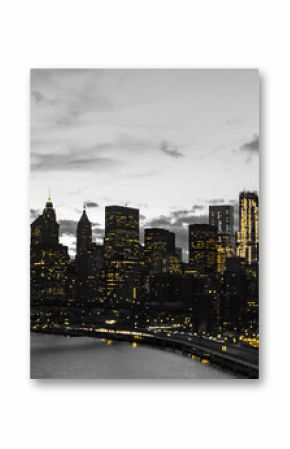 Yellow lights in black and white skyline scene of Lower Manhattan buildings in New York City