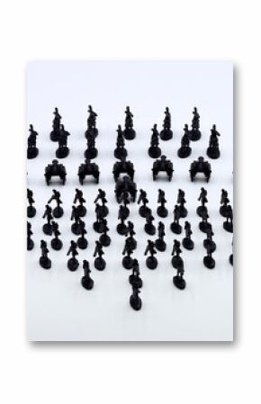 regiment of black plastic soldiers on white background