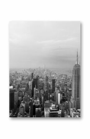 Black and white view of New York City skyline looking down past the Empire State Building towards downtown skyscrapers with vintage colors giving off a 90's feel
