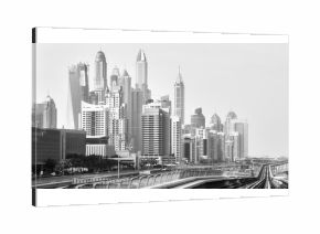 Old black and white film style picture of Dubai skyline.