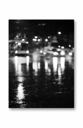 Rainy city road at night. Defocused black and white image