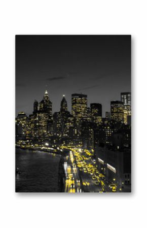 New York City black and white night skyline with golden yellow lights glowing in downtown Manhattan