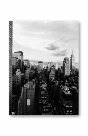Vertical grey scale shot of the buildings and skyscrapers in New York City, United States