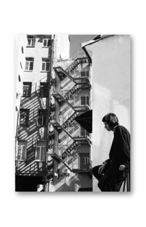 girl walks through the streets of the city, black and white photo