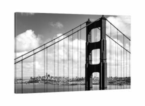 Part of the Golden Gate Bridge and the skyline of downtown San Francisco (California, USA) in the background. High-contrast black and white shot on a sunny day from the “Battery Spencer” viewpoint