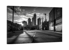 Urban alleyway at dawn, long shadows