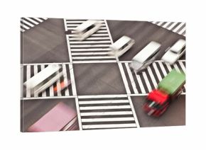 Cars driving through intersection of Shibuya Crossing in Tokyo, Japan