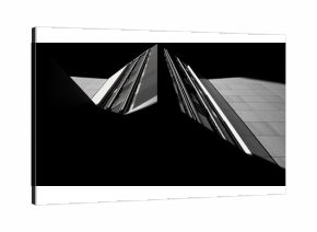 Geometric Reflections: A minimalist black and white photo of a mirrored building facade creating a striking geometric composition.