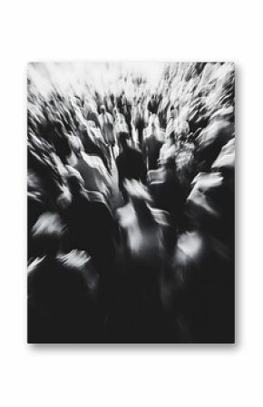 Abstract black and white image of a crowd of people in motion
