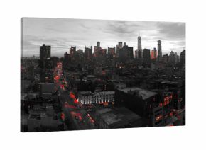 Red lights of the New York City skyline shining against a black and white cityscape in Manhattan NYC