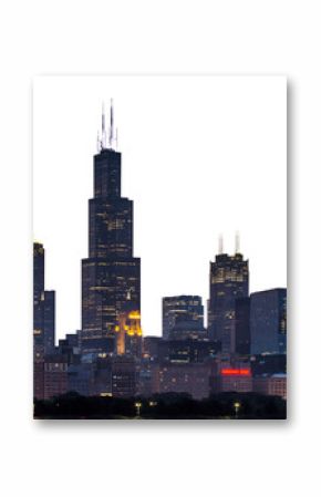 The Chicago skyline at dusk with illuminated buildings against a darkening sky, concept of city life