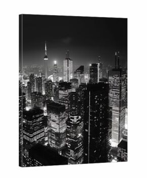 A high-contrast black and white photograph of a city skyline at night, with bright lights glowing against the deep darkness of the night sky. 8k UHD, suitable for high-quality printing or digital 