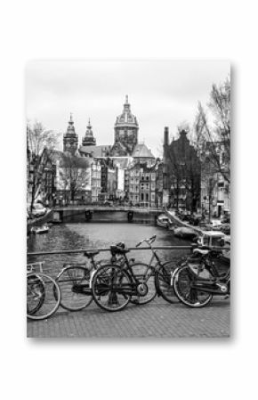 Bicycles on a bridge in Amsterdam, Netherlands. Black and white image.