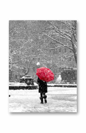 Woman with red umbrella in black and white New York City snow