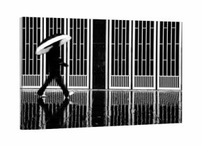 Abstract of a man with the umbrella walking in the rain. Monochrome