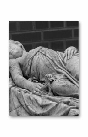 A female sculpture monument at the cemetery