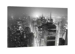 A dramatic black and white rendering of a urban cityscape at night