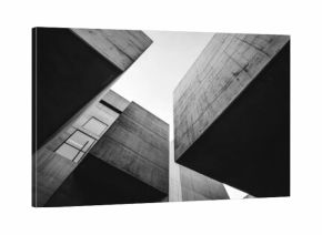 A black and white photo of a building with a lot of windows
