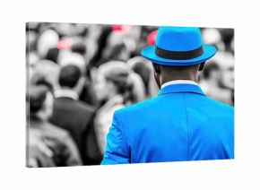 black and white photo of man standing in crowd, man wearing vibrant blue suit