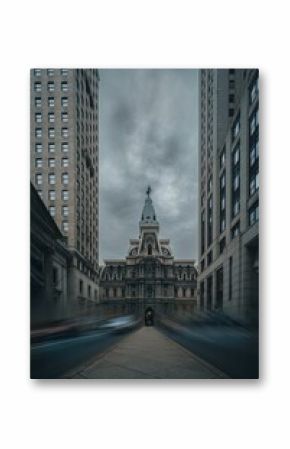 Vertical shot of Philadelphia City Hall between buildings in Pennsylvania, long exposure