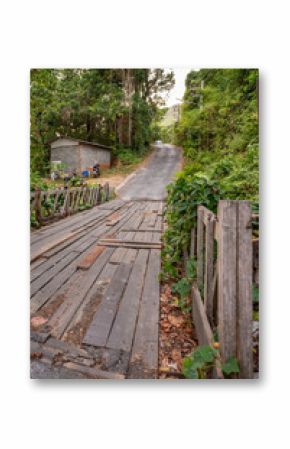 Patchwork wooden walkway on a road in Thailand
