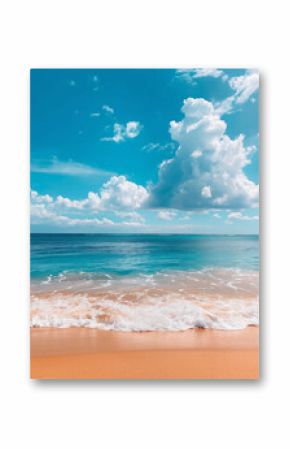 A vertical picture of a seaside beach with waves lapping up on the sand against a beautiful summer sky.