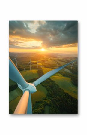 Invigorating view of the horizon lined with wind turbines against the captivating colors of the evening sky
